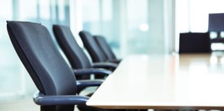 AGA elects Delaware North CEO Lou Jacobs as new chair Chairs around a table in a corporate boardroom
