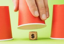 Polymarket CEO Coplan says regulated sportsbooks ‘scam’ their customers Money wooden block under cup game
