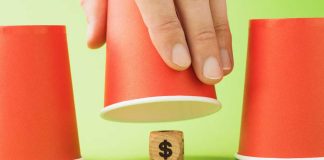 Polymarket CEO Coplan says regulated sportsbooks ‘scam’ their customers Money wooden block under cup game