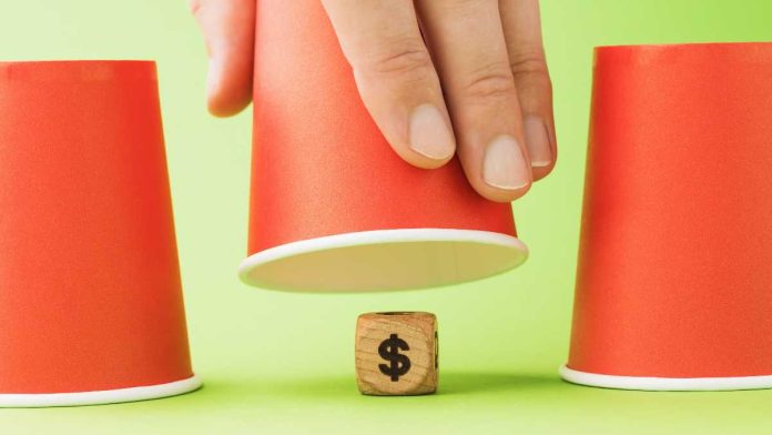 Coplan-Polymarket-sportsbook-comments Money wooden block under cup game