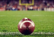 NFL ball as FanDuel plans to launch a group parlay feature for Thanksgiving.