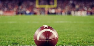 NFL ball as FanDuel plans to launch a group parlay feature for Thanksgiving.
