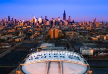 Aerial view of the United Center with the Chicago skyline in the background