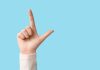 CA judge hands tribes first loss in sports contract legal battle Hand making loser symbol