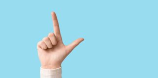 Hand making loser symbol