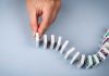 Kalshi argues Massachusetts injunction could topple entire ecosystem Hand stopping dominos from falling