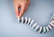 Kalshi argues Massachusetts injunction could topple entire ecosystem Hand stopping dominos from falling