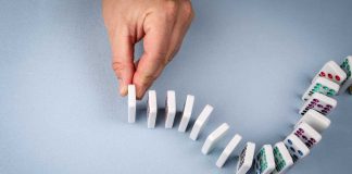 Kalshi argues Massachusetts injunction could topple entire ecosystem Hand stopping dominos from falling