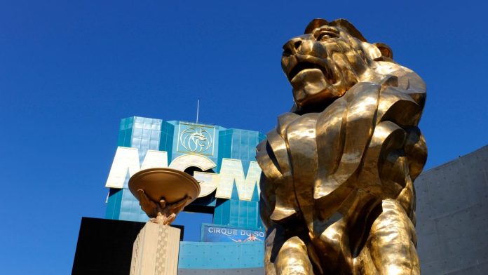 The MGM lion in front of the MGM Resorts logo on a building in Las Vegas, Nevada