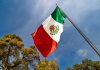 Mexico close to hiking gambling tax to 50% after Senate approval The flag of Mexico flying above trees in the sunshine