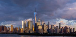 New York regulator will reassess licenses of prediction market participants The skyline of Manhattan, New York City under dark purple clouds
