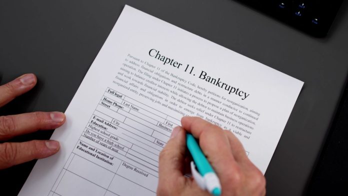 Prime-Sportsbook-files-for-bankruptcy-ahead-of-planned-Plannatech-sale A person signing a Chapter 11 bankruptcy form