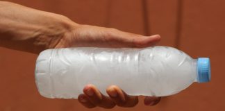 Robinhood freezes sports contracts in Nevada after injunction denied A person holding a water bottle full of frozen water turned to ice