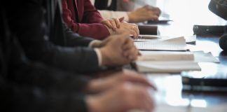 A committee sits as PENN received a committee report regarding its issues with HG Vora.
