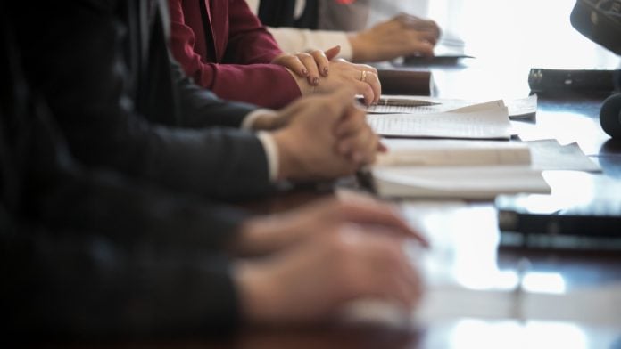 A committee sits as PENN received a committee report regarding its issues with HG Vora.