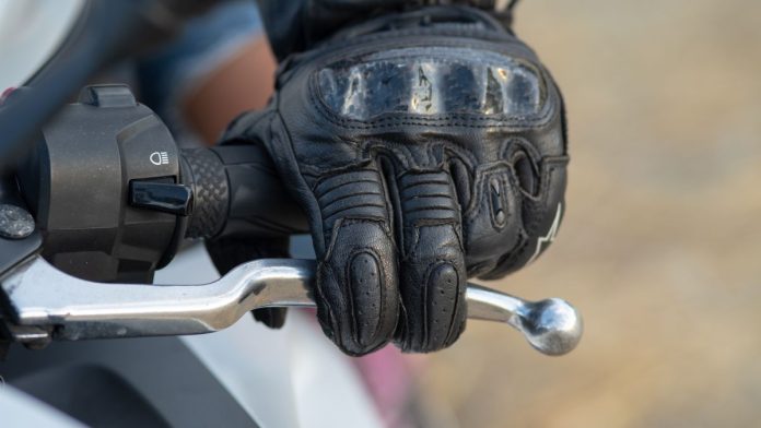 Wisconsin-pumps-brakes-on-sports-betting-discussion-until-2026 A person riding a motorbike pressing the brake lever
