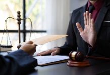 Hand rejecting envelope in judicial setting