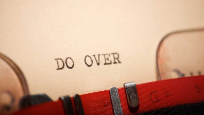 Typewritten words "Do over" on a piece of paper