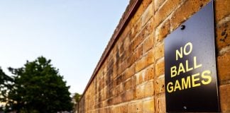 Crypto.com pulls sports contracts in several states amid pushback A sign on a brick wall stating that playing ball games in the area is not allowed