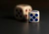 Two dice displaying the number five