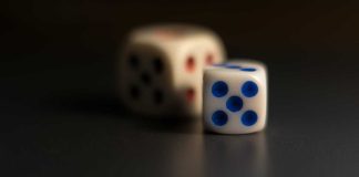 Two dice displaying the number five