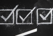 Three checkmarks on a chalkboard