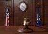 Kalshi takes Connecticut regulator to court over cease and desist letter Courtroom with US and Connecticut flagsI