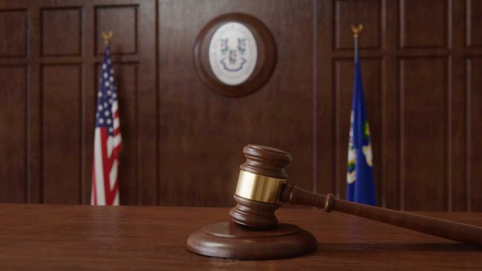 Kalshi-Connecticut-DCP-Lawsuit Courtroom with US and Connecticut flagsI