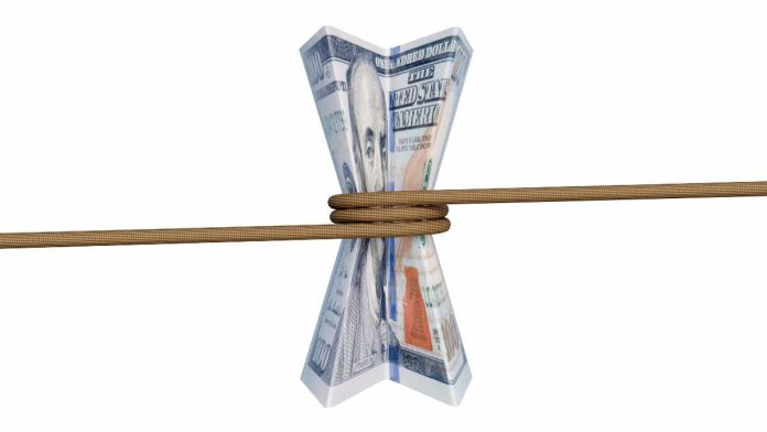 MA-Gaming-Commission-Proposed-Limiting-Reg Rope around a $100 bill