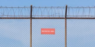 Nevada regulators want Wayne Nix blacklisted from casinos A barbed wire fence with a restricted sign on it