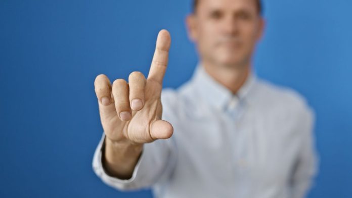 US-Sports-Betting-New-States-Fail-2025 A person waving his finger as no new states passed sports betting bills in 2025.