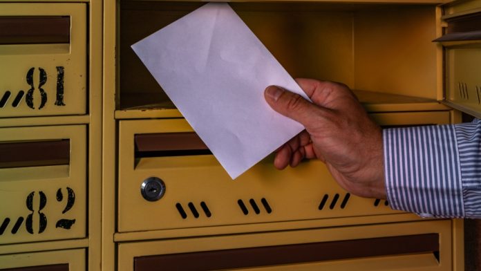 AGA-IGA-Letter-Congress-Sports-Event-Contracts A person sending a letter as the AGA and IGA send a letter to Congress about sports event contracts.