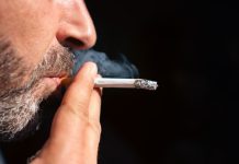 A man smoking a cigarette