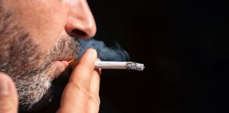 Appeals court re-lights New Jersey casino smoking lawsuit A man smoking a cigarette