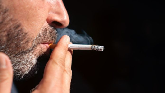Appeals-court-re-lights-New-Jersey-casino-smoking-lawsuit A man smoking a cigarette