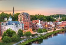 The Augusta, Maine, skyline on the Kennebec River at dusk