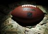 NBA star Devin Booker bets $1M on NFL amid league gambling woes A NFL ball with money as the NBA guard Devin Booker bets on Super Bowl LX.