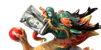 Ceramic dragon with $100 bill in mouth