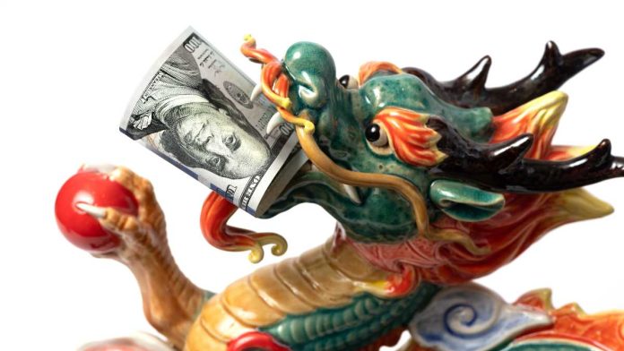 Ceramic dragon with $100 bill in mouth