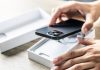 NCPG unveils new 1-800-MY-RESET national problem gambling helpline A person taking a brand new phone out of its box