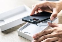 A person taking a brand new phone out of its box