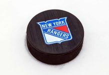 Polymarket and NHL’s NY Rangers team up in new partnership Hockey puck with New York Rangers logo