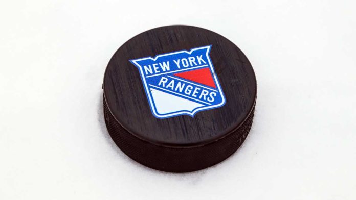 NY-Rangers-Polymarket-Partnership Hockey puck with New York Rangers logo