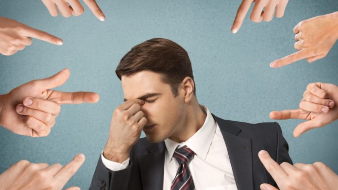 New-York-Harrassment-Measures-Gambling Person with fingers being pointed at them as New York lawmakers consider a anti-harassment bill for athletes and gambling.