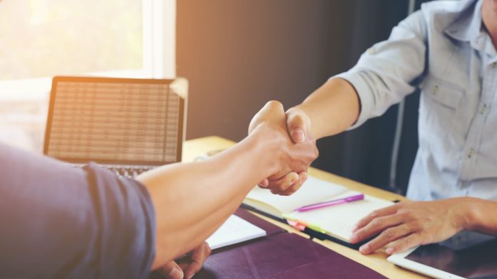 People complete a deal as Allwyn completes its acquisition of a majority stake in PrizePicks.