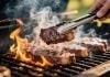 Tennessee AG says turning up heat on sweeps casinos led to exits A person grilling steaks over a high flame