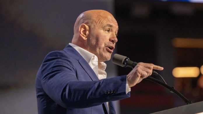 UFC CEO Dana White speaking at a podium