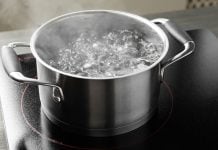 A pot of boiling water on a stovetop