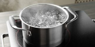 A pot of boiling water on a stovetop