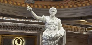 Caesars debuts first in-house original slot Ca$hline Statue of Julies Caesars in a Caesars property in Las Vegas